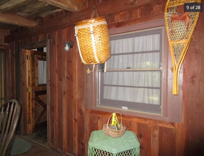 wooden porch with hanging basket